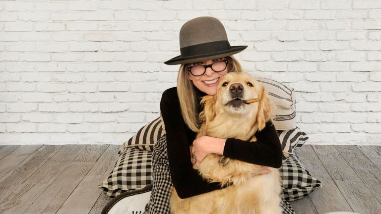 The easiest way to make a neutral staircase look stylish is with a statement lighting trend seen in Diane Keaton's home – it's ridiculously simple